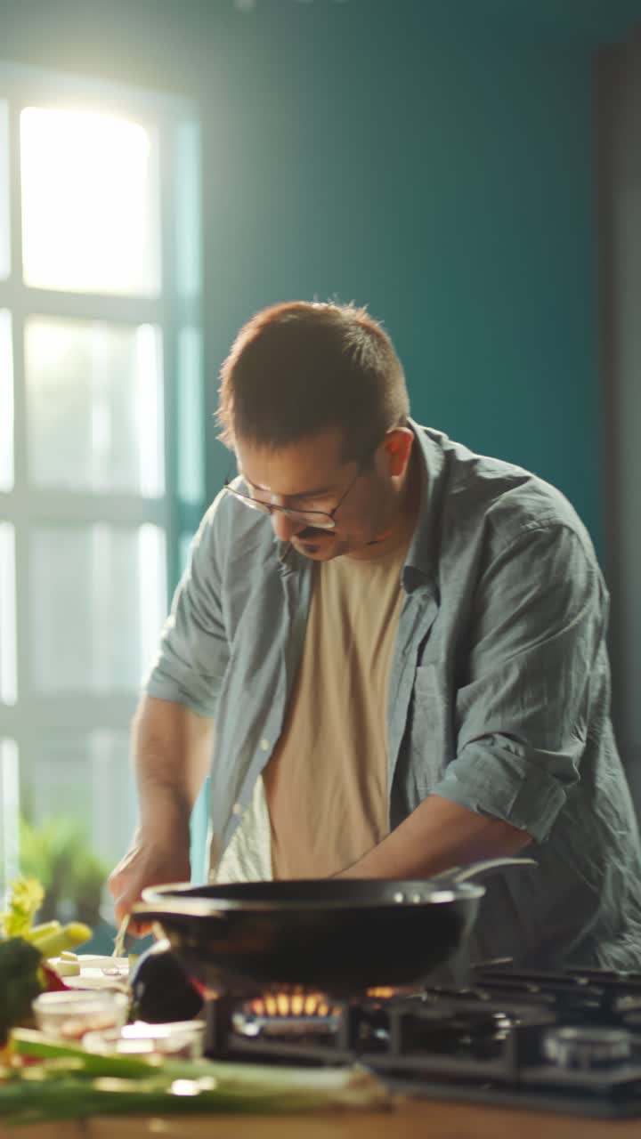 Man cooking food in a frying pan