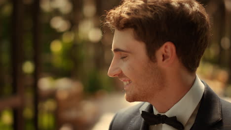 cheerful guy laughing outdoors