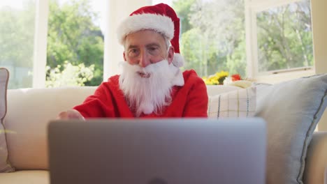 Senior-caucasian-man-at-christmas-time--wearing-santa-costume