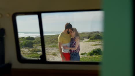 young couple embracing each other on the beach 4k