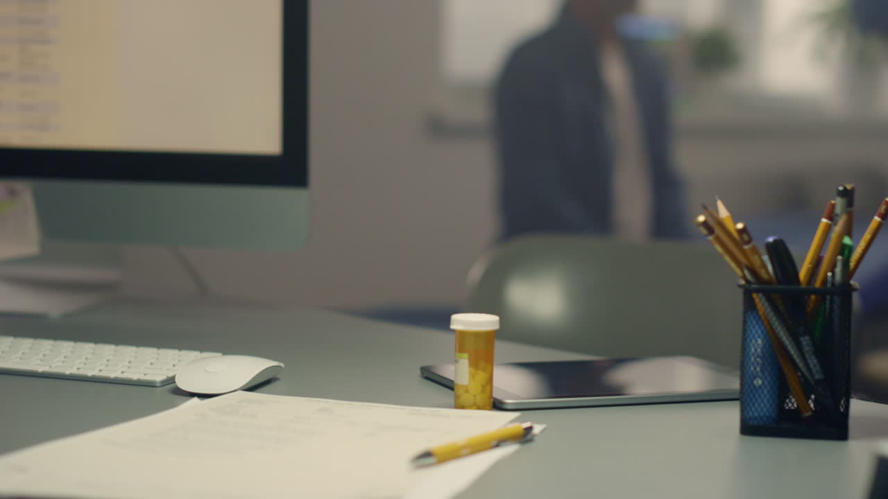 View doctor modern workplace. Woman therapist checking throat senior patient.