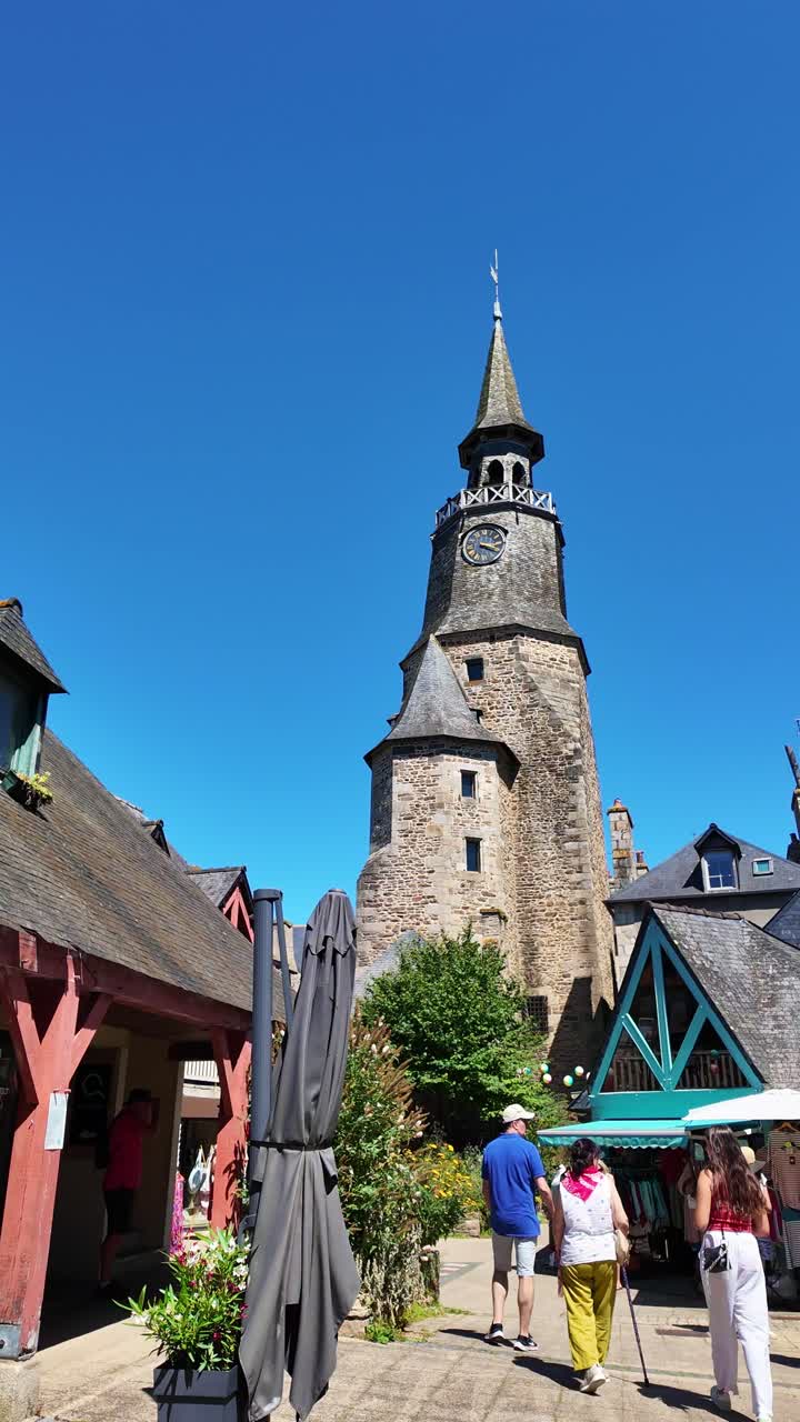 The clock tower or Tour de l'Horloge, Dinan, France. Handheld shot and vertical format, sky for copy space.