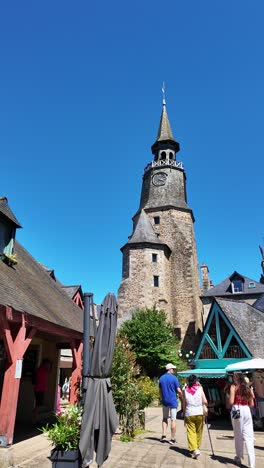 the clock tower or tour de l'horloge, dinan, france. handheld shot and vertical format, sky for copy space.