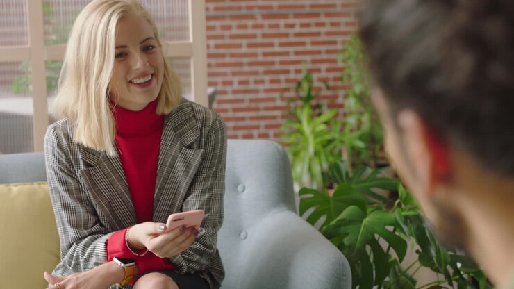 businessman using tablet computer browsing data on screen colleagues meeting client shaking hands enjoying professional business people collaborating planning partnership in startup office