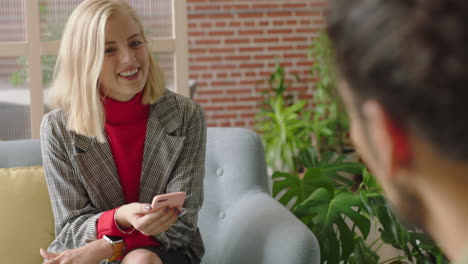 businessman using tablet computer browsing data on screen colleagues meeting client shaking hands enjoying professional business people collaborating planning partnership in startup office