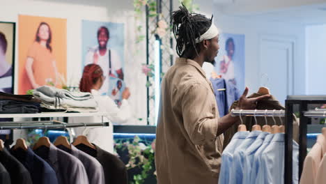 clients look for new clothes on racks