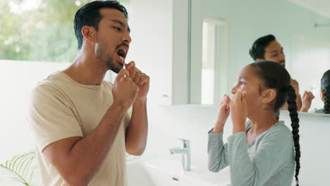 dad, girl with floss and cleaning teeth