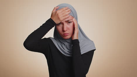 woman rubbing temples to cure headache problem, suffering from tension and migaine, stress, pain