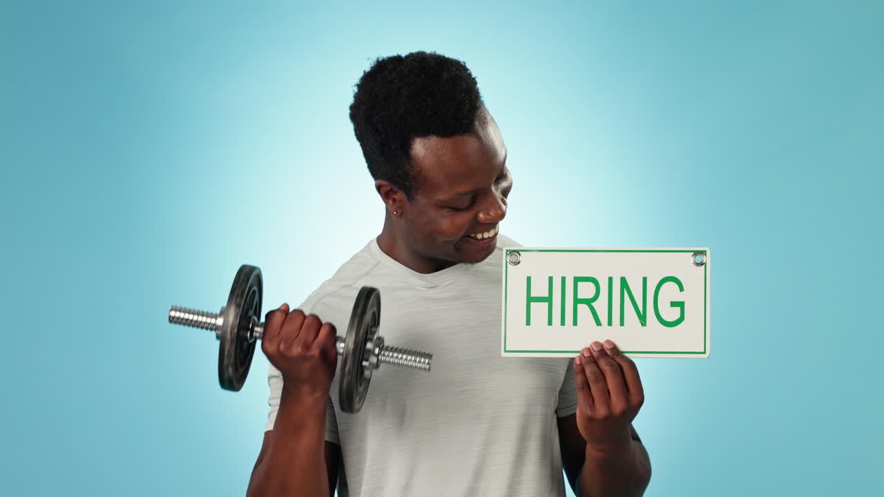 Happy black man, dumbbell and hiring sign for gym