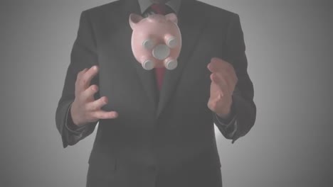 animation of businessman throwing and catching piggybank, on grey background