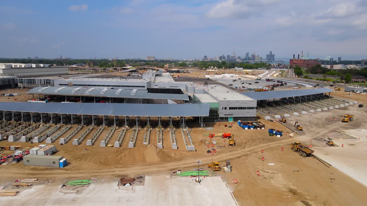 Customs terminal building in construction site for Gordie Howe bridge, aerial view
