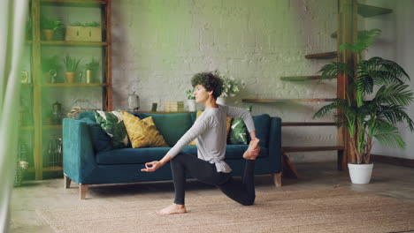 woman practicing yoga at home