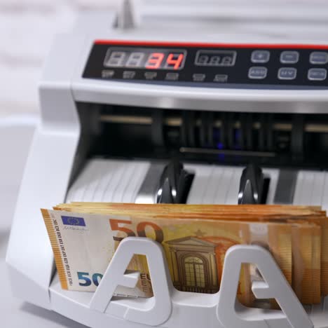 machine for counting money. euros banknotes. finance concept. mechanism for bank financial operations