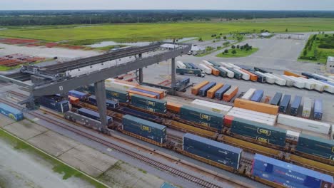 4K-Drone-Video-of-Trains-and-Trucks-at-CSX-Intermodal-Train-Yard-in-Winter-Haven,-FL