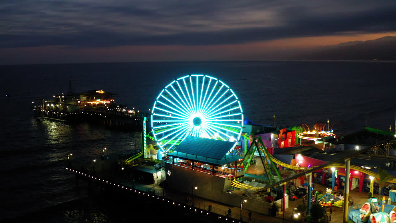 Vibrant Night Lights of the Pacific Wheel at Santa Monica Pier