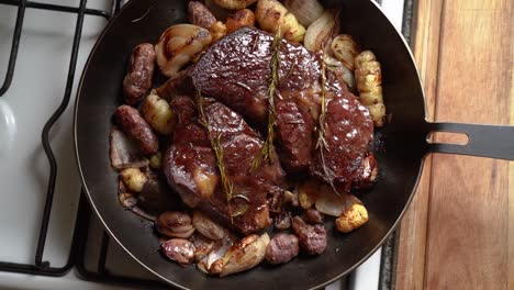 roasted beef with potatoes in cooking pan