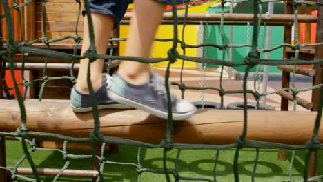 Low-section-of-mixed-race-schoolgirl-playing-in-school-playground-on-a-sunny-day-4k