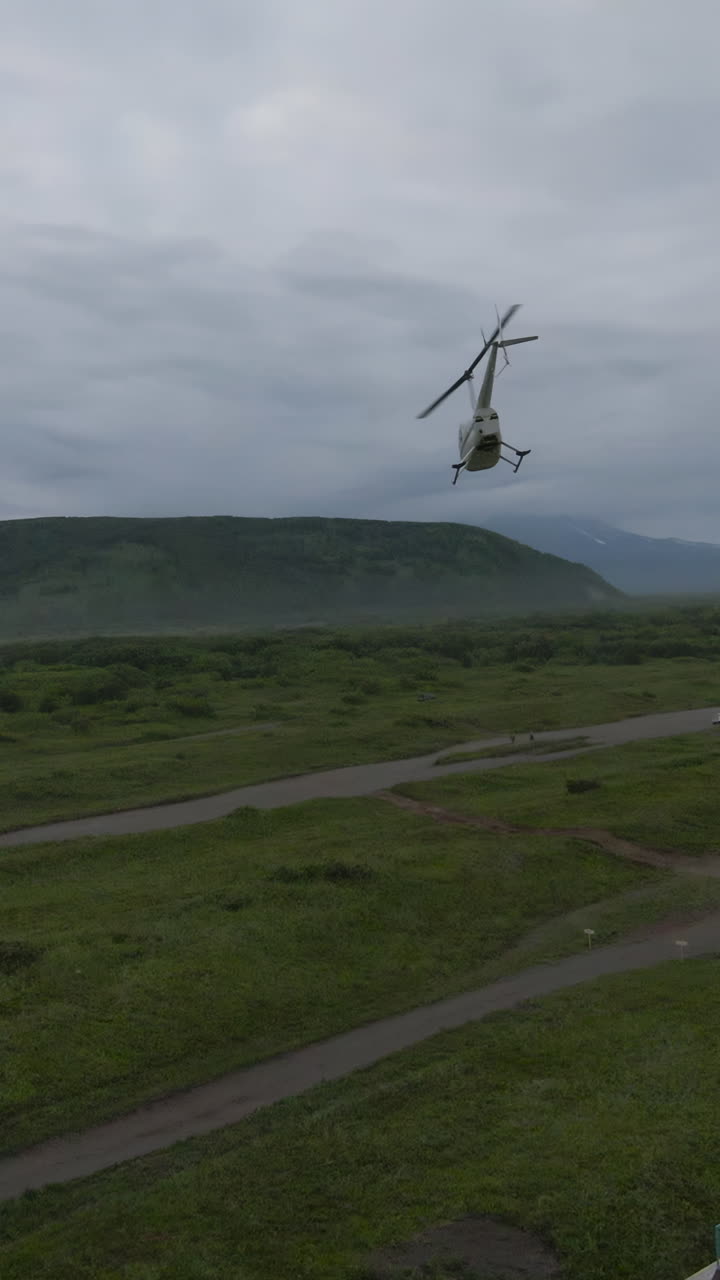 Helicopter Flight Over a Mountainous Rural Landscape