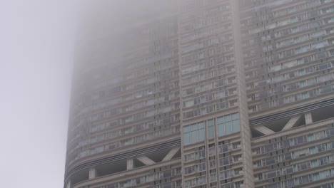 hong kong highrise surrounded by mist