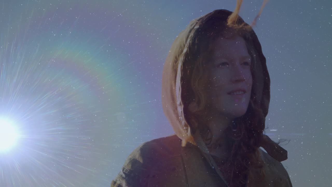 Gusty wind lifting woman's hair across face at sunrise with animated halo overlay for travel ad