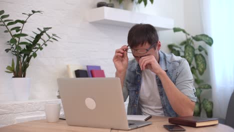 tired worker overworked on computer. frustrated businessman working alone. office work overtime. workaholic work in internet deadline.tired businessman. overwhelmed exhausted stressed man