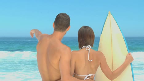 cute couple looking at the sea