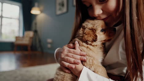 girl playing with puppies in living room