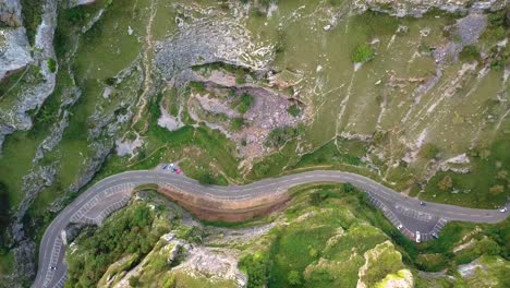 top view of curvy road amidst mountain