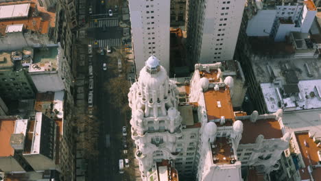 AERIAL---Palacio-Barolo-building,-Montserrat,-Buenos-Aires,-Argentina,-rising-shot