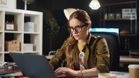 tired lady warming up arms in night office