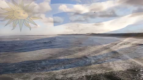 composición digital de ondear la bandera de uruguay contra la vista aérea de las olas del mar