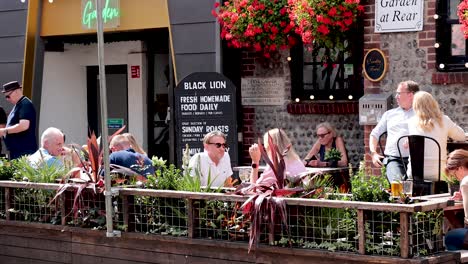 people enjoying a sunny day at a café