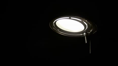 men turning on lamp / slow motion