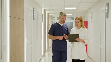 doctors discussing in a hospital corridor