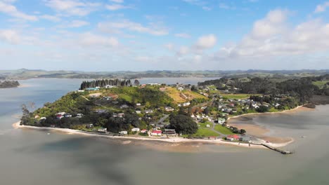 drone camera circling around the peninsula of pahi, new zealand