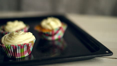 making muffins. cooking cupcakes. hand take away cake from baking tray