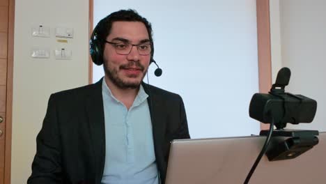 man in a formal corporate video call