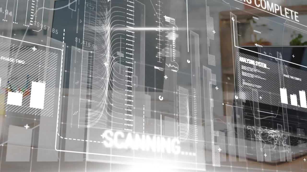 Digital composite video of digital interface with data processing against laptop of office desk