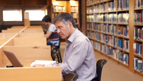 handsome teacher using laptop