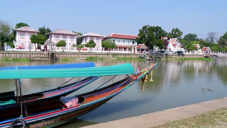 long boat moving along ayutthaya river