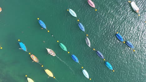 colourful sailing boats moored overhead birds eye drone aerial view