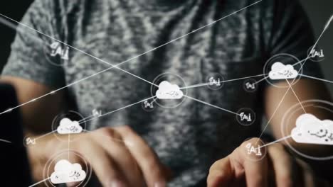 man using a laptop with a hologram of a cloud computing network