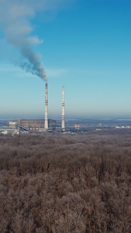 aerial view of industrial zone. air pollution by smoke coming out of two factory chimneys