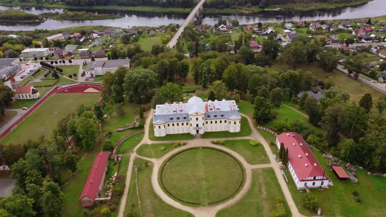 Beautiful Kraslava castle in Latvia, aerial orbit view