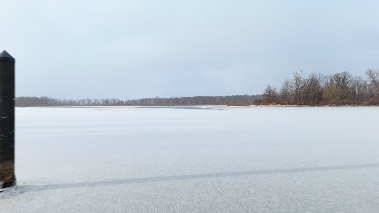 Flying over a frozen bay at Presque Isle State Park.