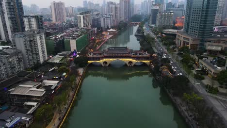 establishing aerial of river and downtown city of chengdu, china