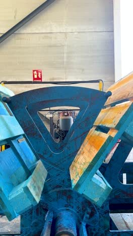 close up of a turning palet machine while in production of chep units