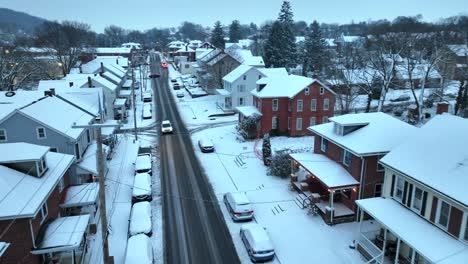 snow-covered street with quaint snowy houses