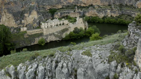 abandoned monastery of our lady of the angels la hoz revealed behind limestone gorge of river duraton