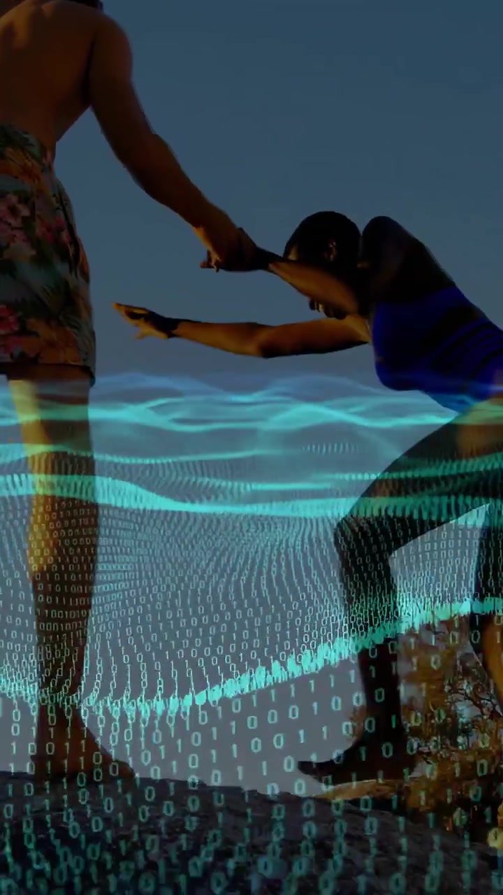 Vertical video: Man offering hand to woman, pulling up rocky ledge, tech wave bits guiding balance